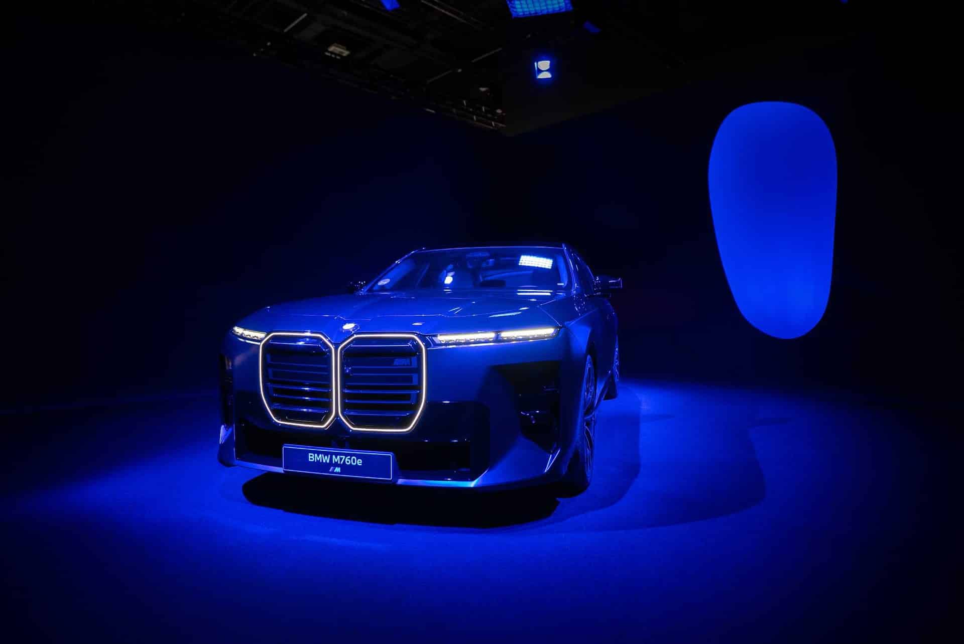 BMW M760e xDrive lit in blue at the centre of the SYMBIOSIS installation, Art Basel Hall 1