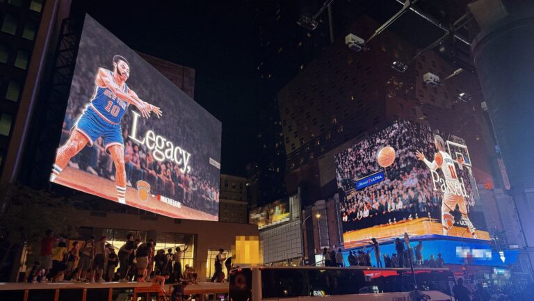 Michelob ULTRA Legacy Passed Times Square billboards bridging Walt Frazier to Jalen Brunson, a moment marketing execution for the Knicks NBA championship